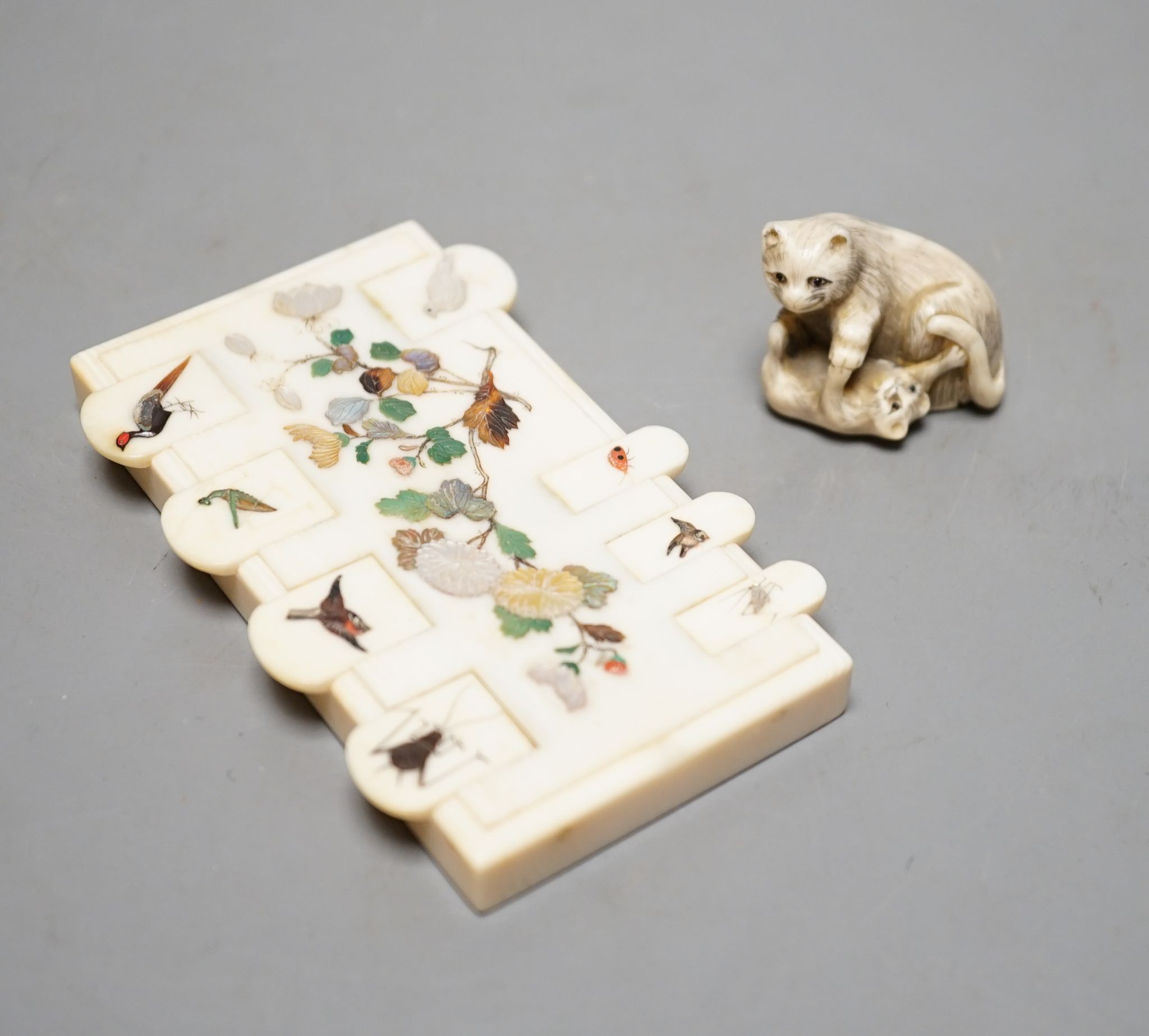 A 19th century ivory netsuke cat group and a Meij period ivory shibayama bezique marker, 9cm.